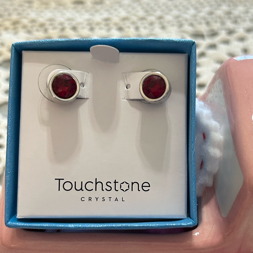 Touchstone Crystal Ice Post Earrings in Siam Red, with box. Used as display.